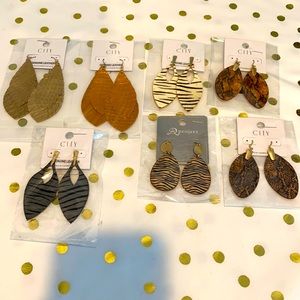 NWT Genuine Leather feather earrings, light gold color, 3 1/4” in length